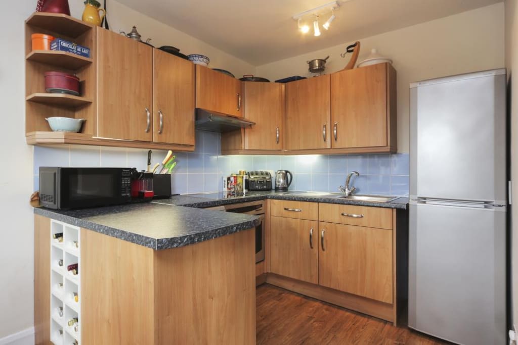 Kitchen with fridge, freezer, oven, dishwasher and washing machine