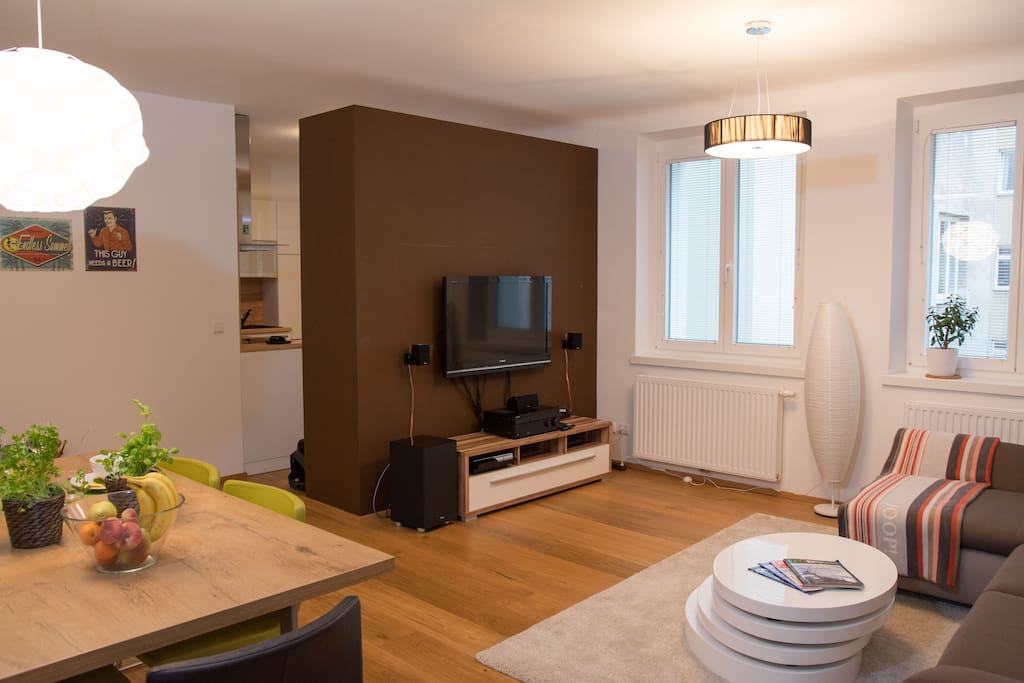 The big living room which is connected to the kitchen comes with your own TV and sound system.