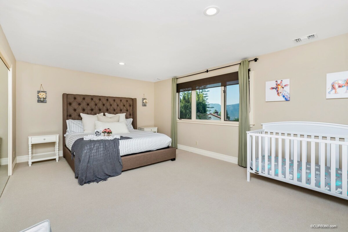 Second Level: Bedroom #5 King Bed, Crib. Smart TV includes Hulu w/ Live TV, ESPN+ & Disney.