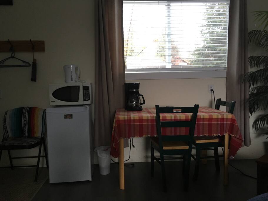 Fridge, Microwave and table work station.