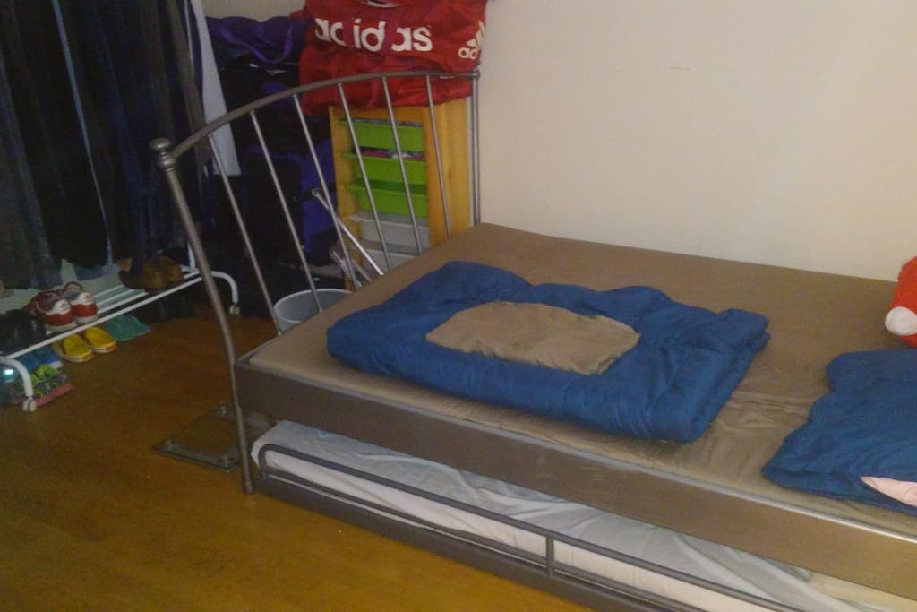 Queen size IKEA bed with pull-out bed.