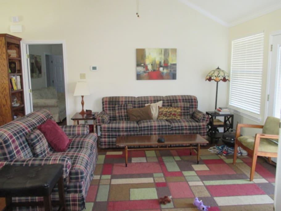 Living Area also features a small round Pub table with chairs, and a 60" TV w/DVD Player and assorted DVD's.
Lamps, Lighted Ceiling Fan.