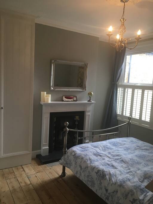 Blackout curtains, built in wardrobe and stripped floorboards