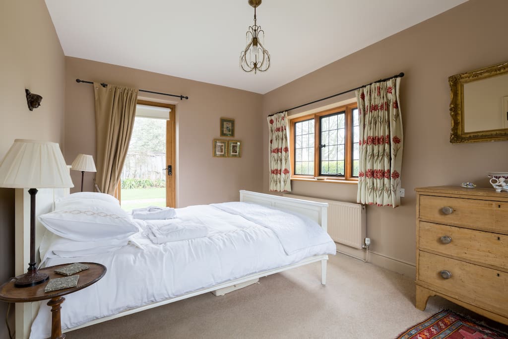Kingsize bed overlooking owners gardens