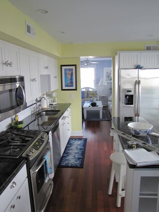 Kitchen area -- looking north toward living room. French doors to the right of kitchen island.