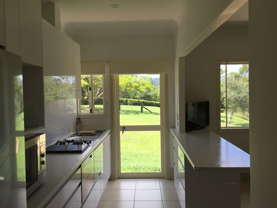 Kitchen leading out onto garden and patio area