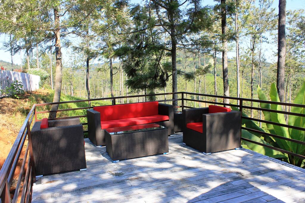 Sit beneath the dappled shade on the deck