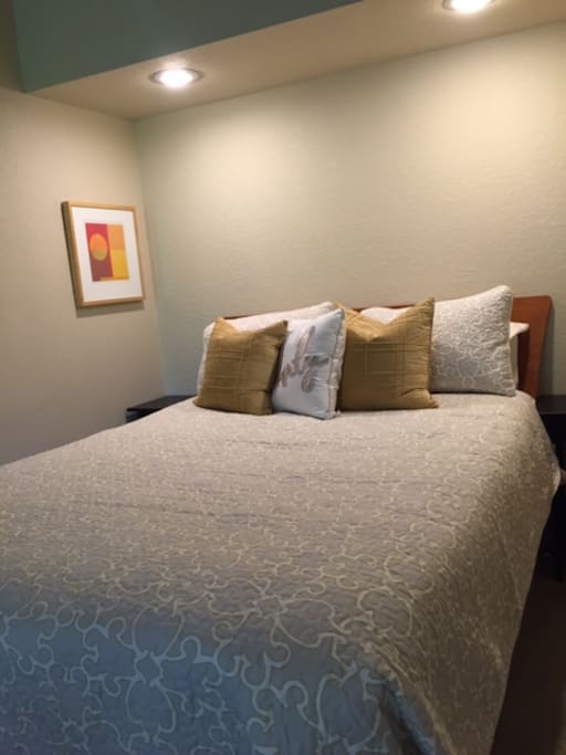 Queen bed with comfortable and quality bedding
