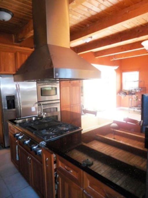 Spacious full kitchen with dual ovens.