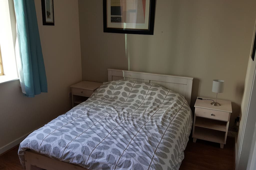Comfortable double bed with natural light in the morning