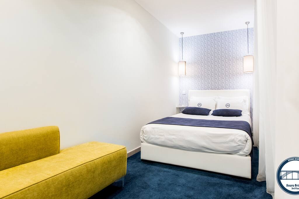 Bedroom with a double size bed and comfy bed linens