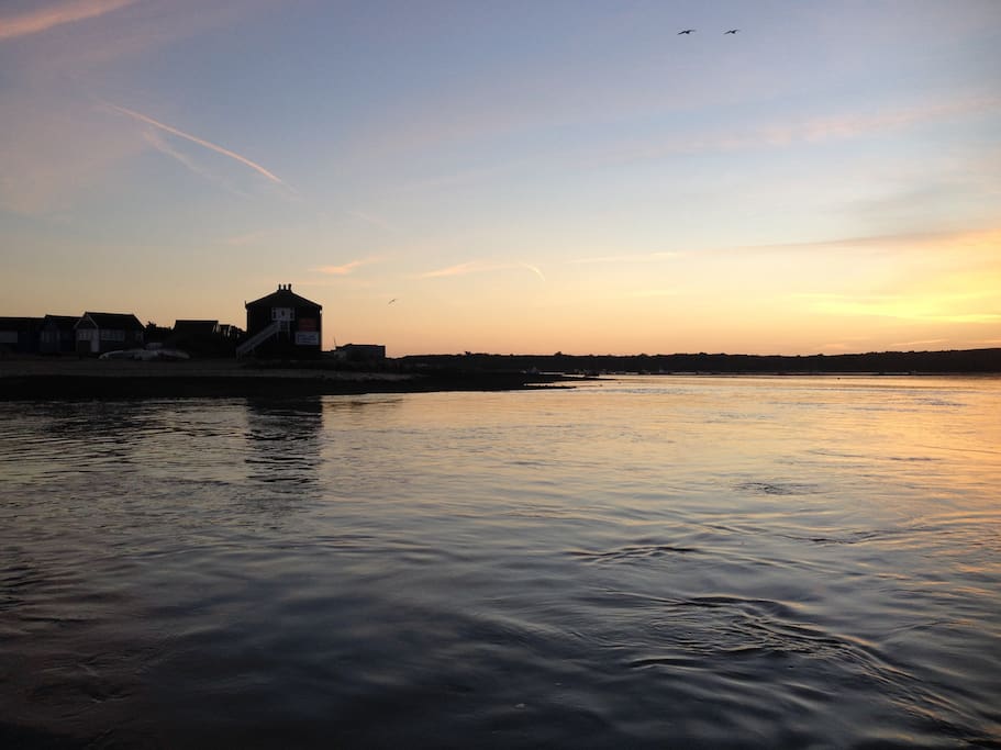 Tranquil harbour by evening, viewed from the harbour's edge