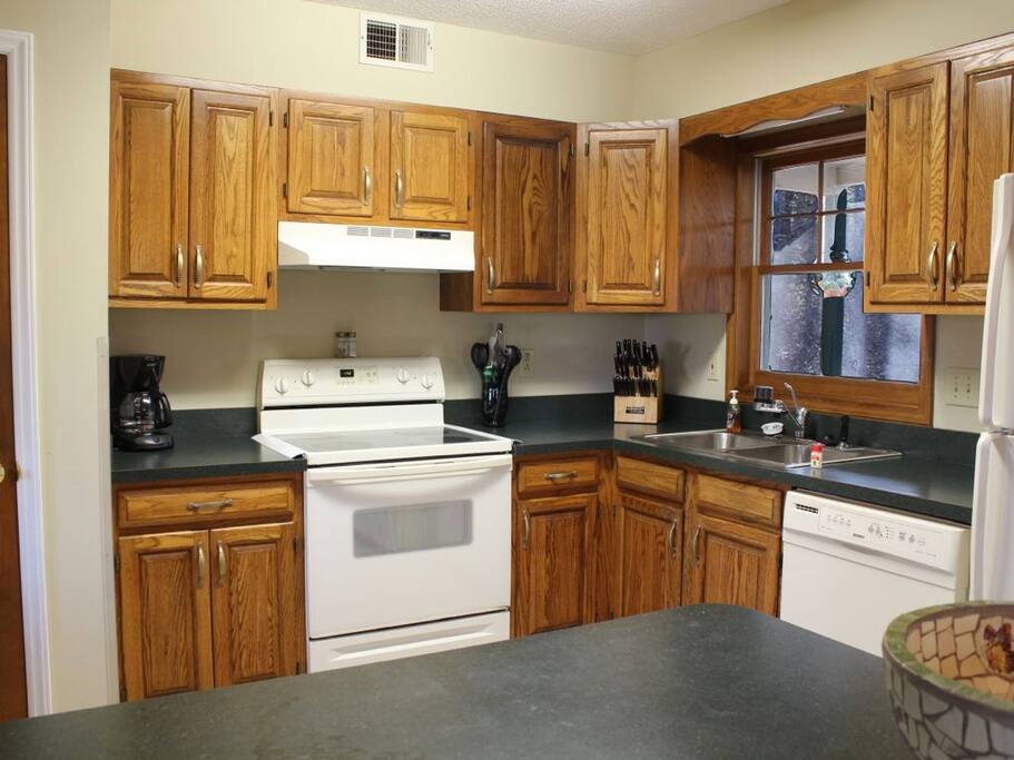 Kitchen w/ breakfast bar.