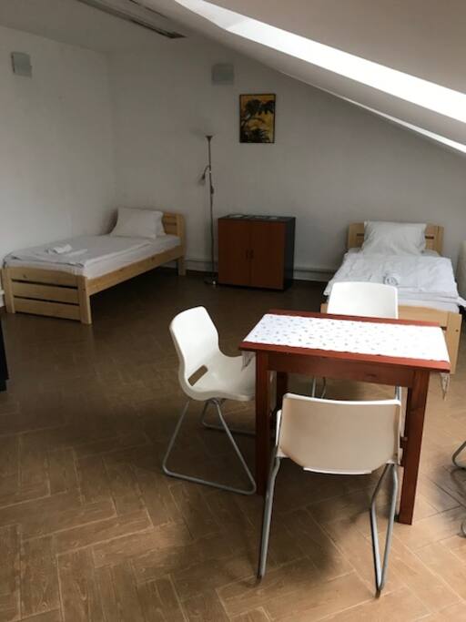 Two single beds, table, chairs, wardrobe