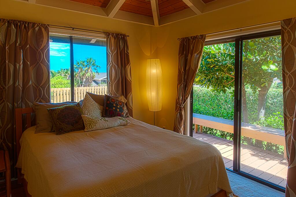 Bedroom with queen bed, private bath and deck
