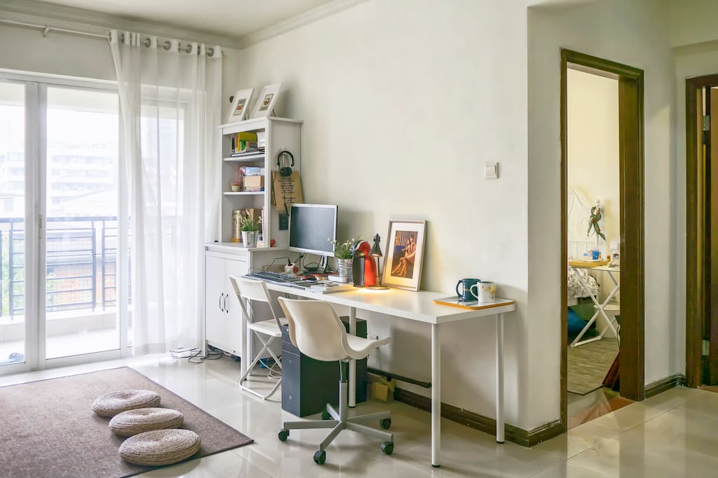The living room also doubles as an office.
