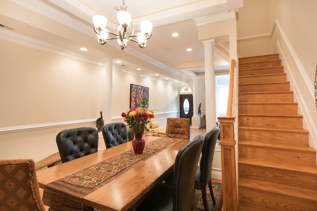 This is dinning room of home. Simply to receive you, this area of the house is off limits; showing first flight of stairs to get to your room.