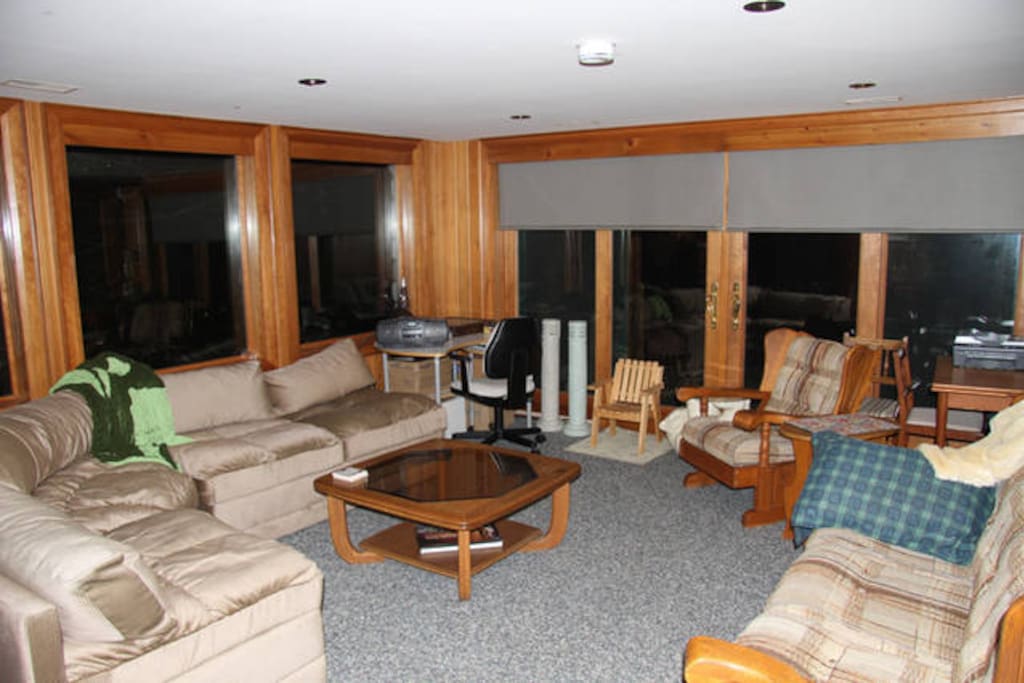 Spacious sitting room in Lower Suite. View of the beach side water from all windows.