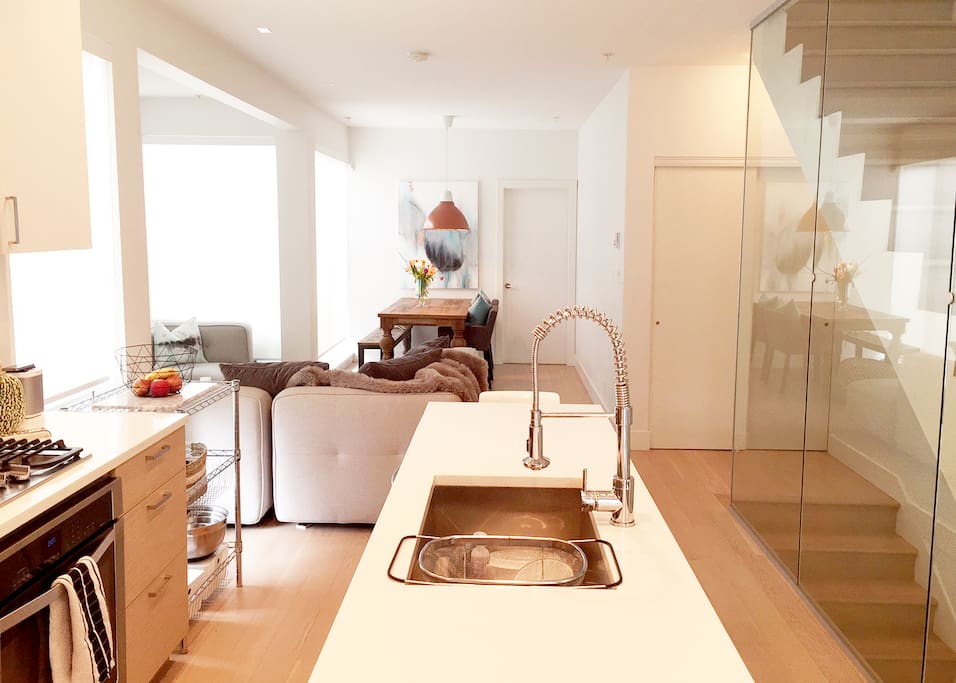 Up one level from the street entrance takes you to the main floor open concept living space.