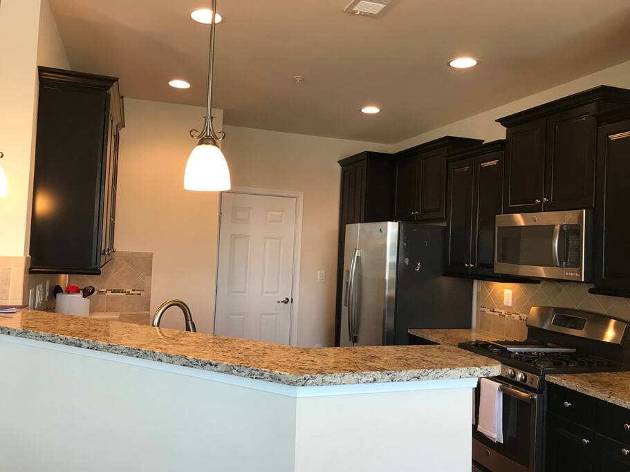 Fully furnished kitchen with granite counters