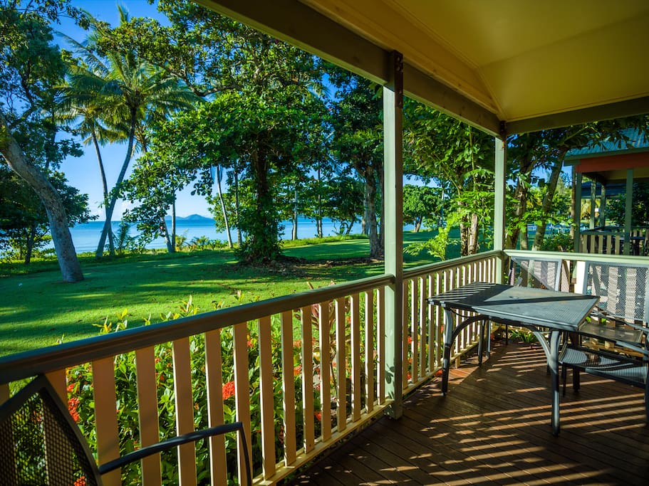 Enjoy a cold drink on your private deck overlooking the beach