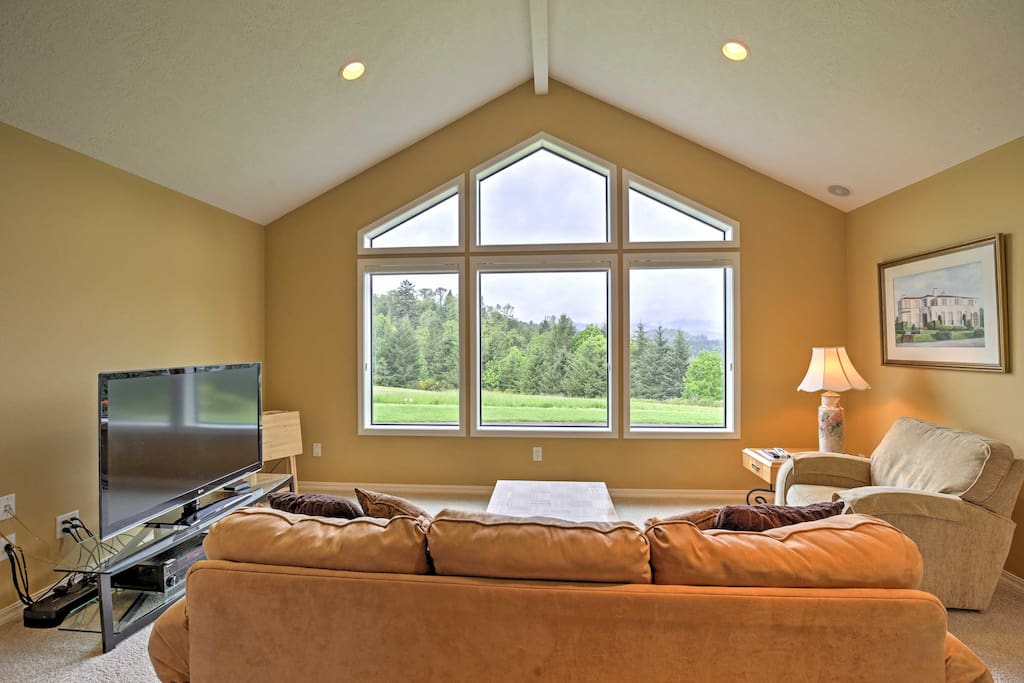 Enter into the home and step inside the tastefully-decorated, free flowing living space with high vaulted ceilings.