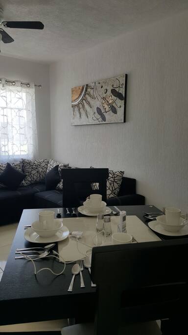 table for 4 people and living room