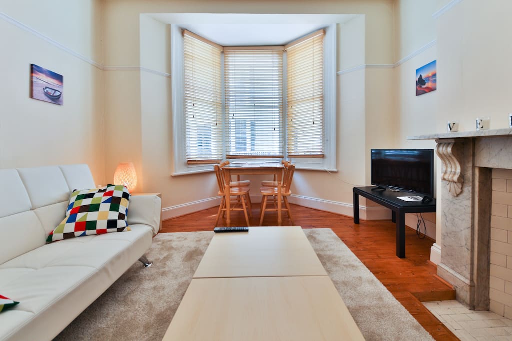 Homely living room with a sofas and dining area