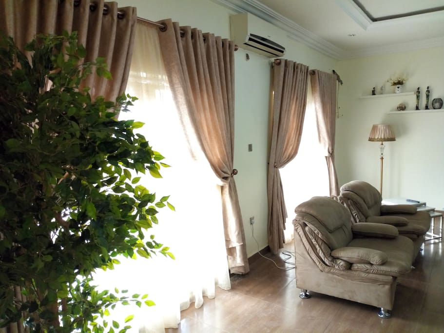 Sitting room with enough lights coming in through the sliding doors leading to the balcony.