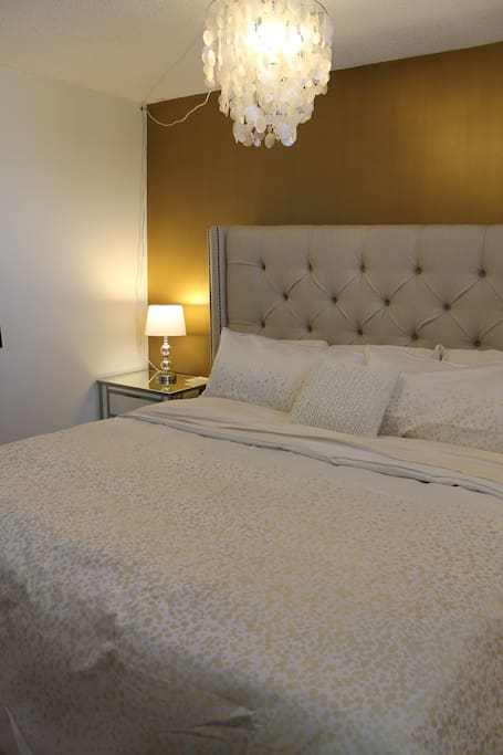 Bedroom with a King Bed. Two night stands.