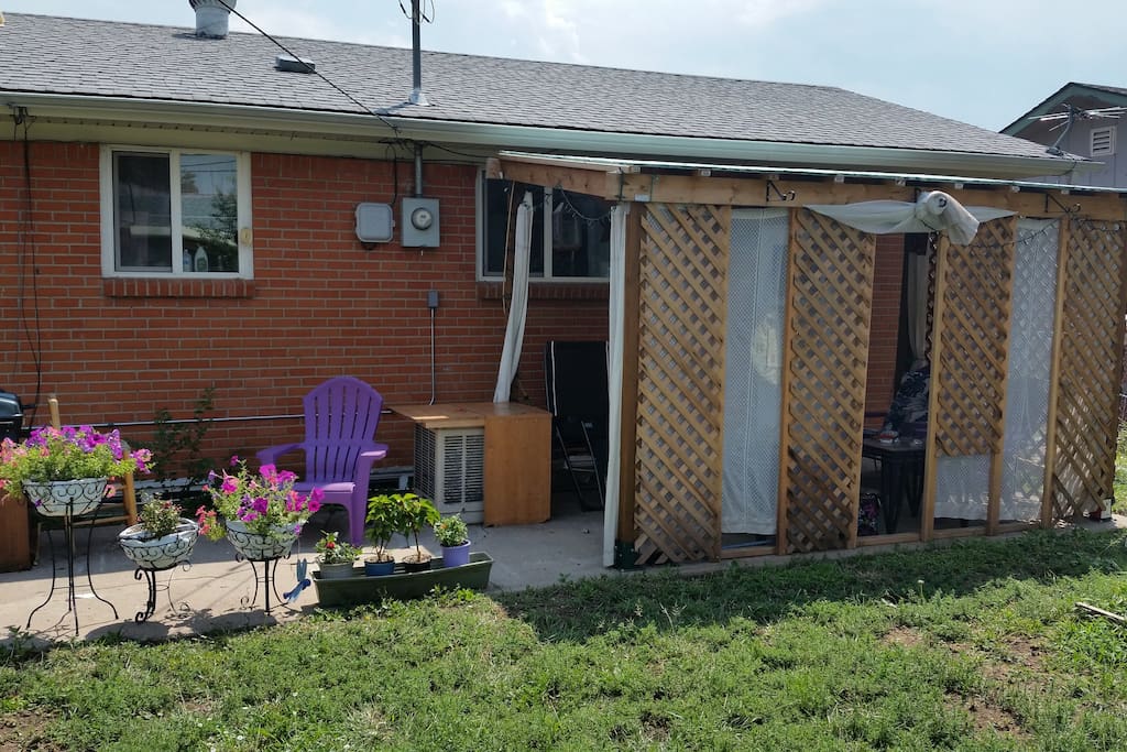 Our newest addition: a covered porch with swamp cooler, chairs and tables!