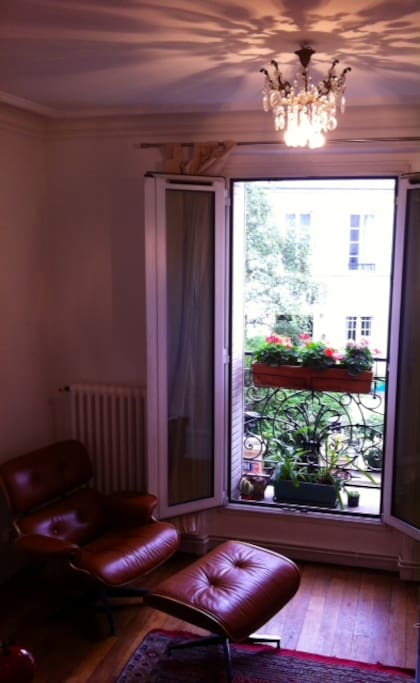 Relax in the Eames chair and gaze out of the double doors or stand on the balcony and sip your espresso. .