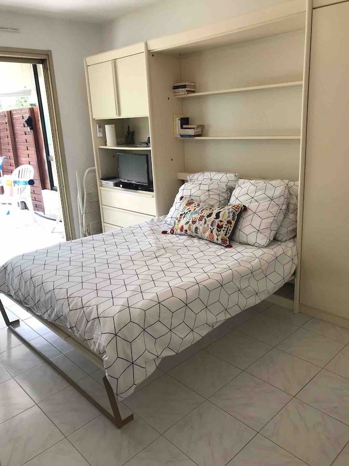 The bed when it is folded down for the night.