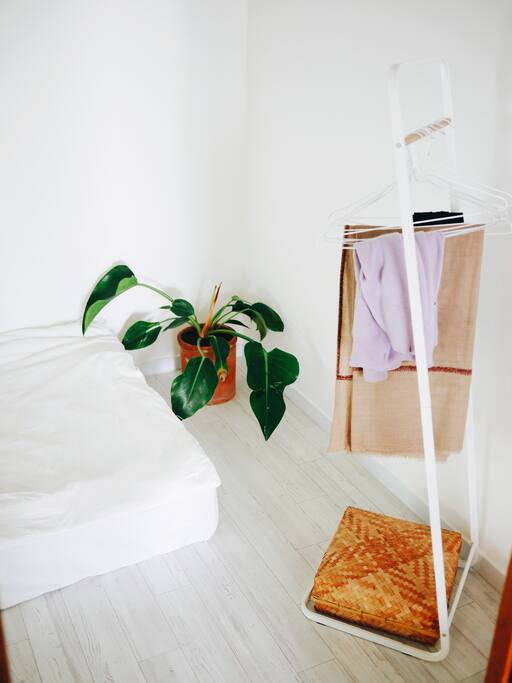 Hanger and basket for belongings.
