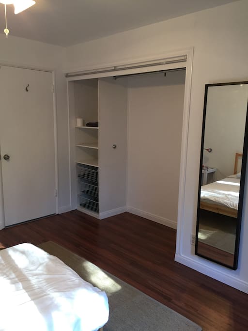 Large and spacious closet, with minimal objects in the room, to declutter the mind.