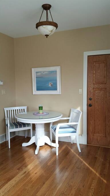 Dining table and chairs located in the living room just off the kitchen.
