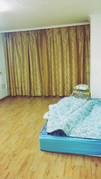 bedroom with one bed and blankets enough for one more guest