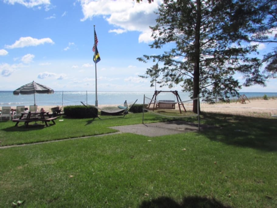 Grounds include swing, picnic areas, firepit, volleyball, badminton, shuffle board, beach.