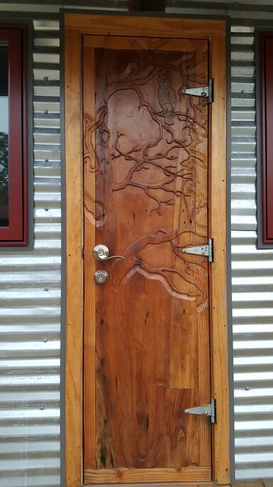 Hand carved door by local artist Larry Bourque