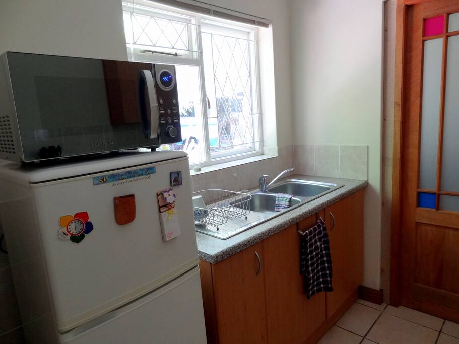 Self Catering kitchen includes washup, fridge and microwave.