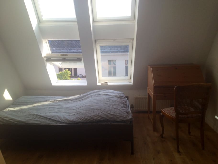 Your bedroom (you can close the blinds inside the windows in case it's too bright)