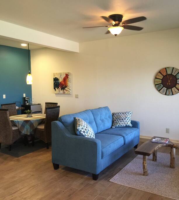 Living area. Queen sofa bed and eating table and bar
