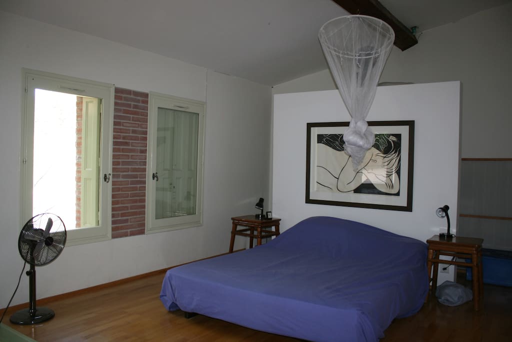the main bedroom (no.1) with double doors to the little courtyard.