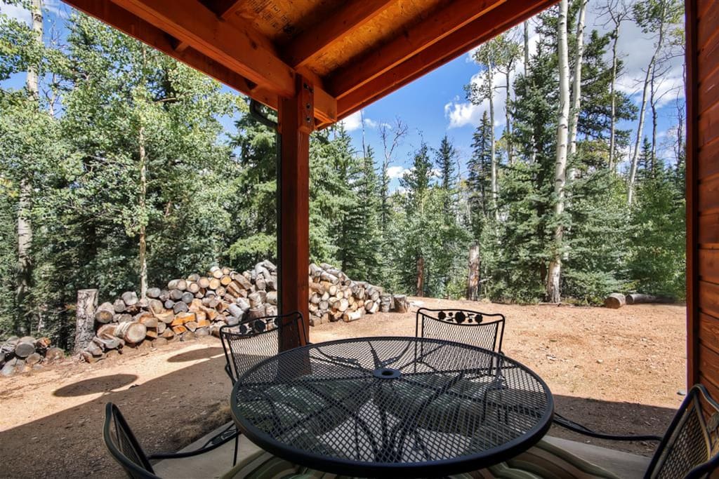 Relax outside on the porch and take in the lovely forest views!