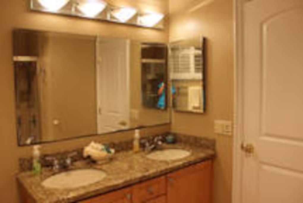 Large bathroom with double sink.