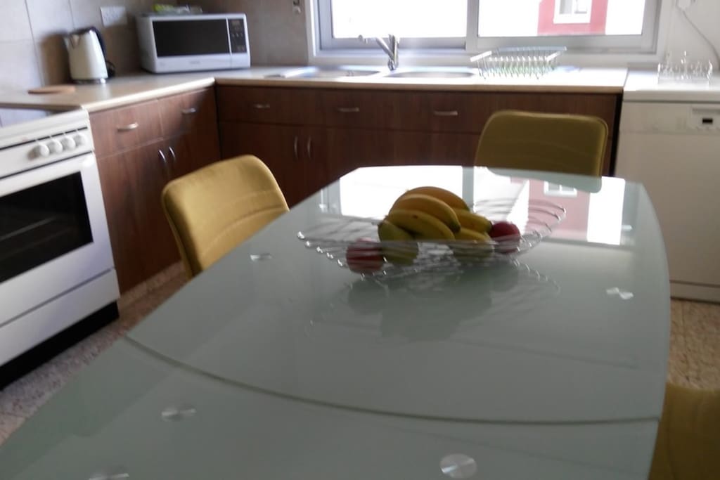 separate kitchen with dinning table for 6 people
