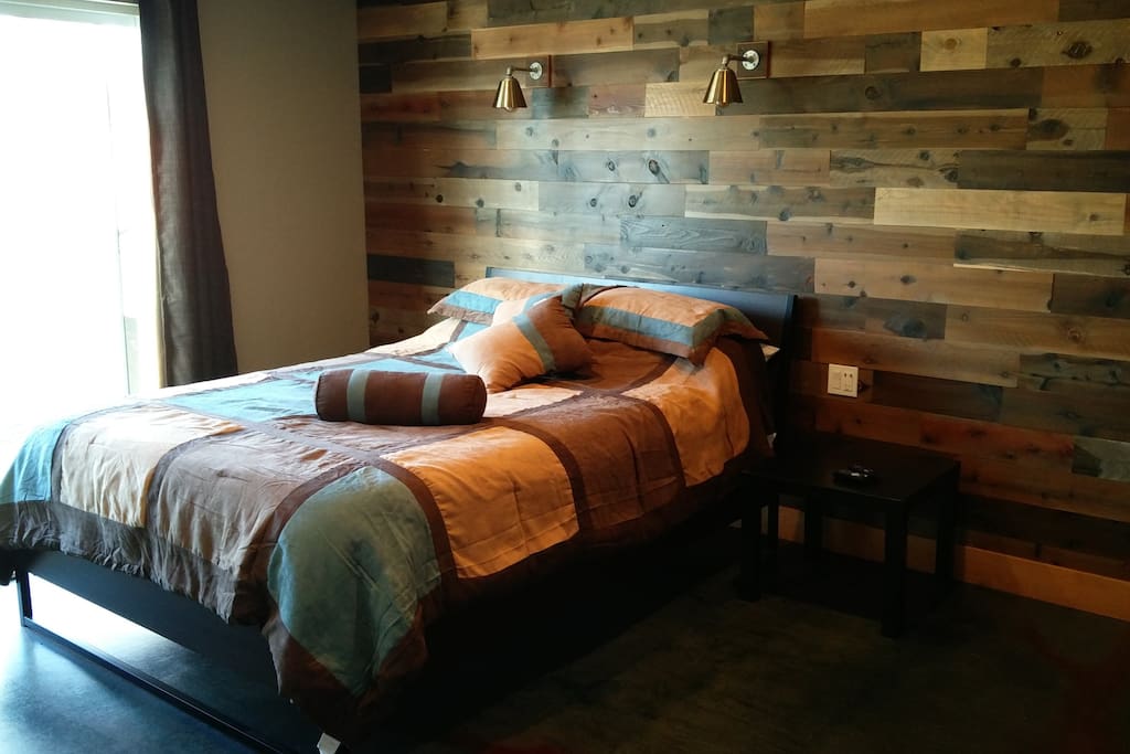 master bed room with old barnwood