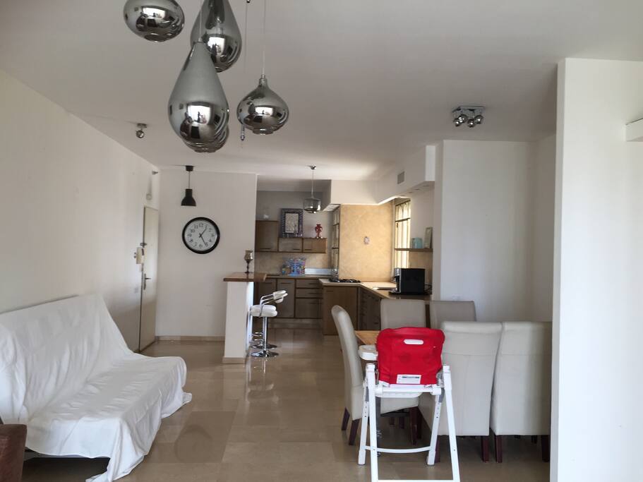 Living room space and kitchen. Large table for 8 people (possibility of baby chair) - Sofa (two people can sleep on it)