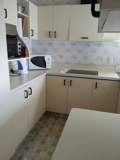 Kitchen includes fridge, miro, cooktop, jug toaster, and all basic kitchen wear.