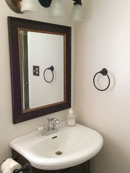 Bathroom has recently been remodeled and re-tiled.